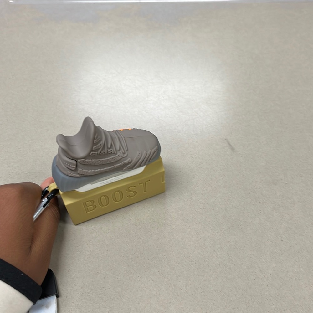 AirPods Pro’s with Yeezy air pod case covering